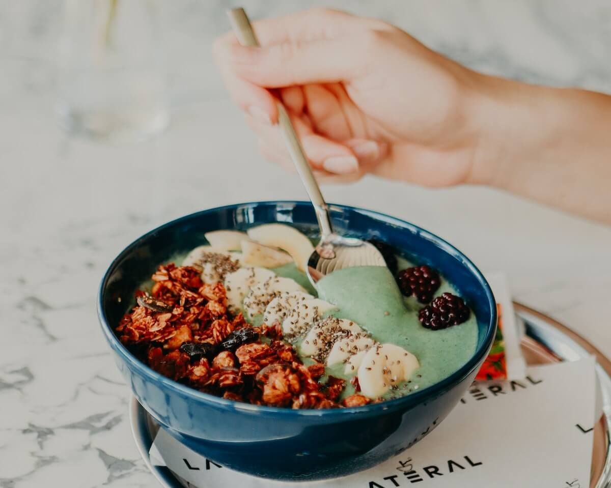 berry-bomb granola breakfast smoothie bowl
